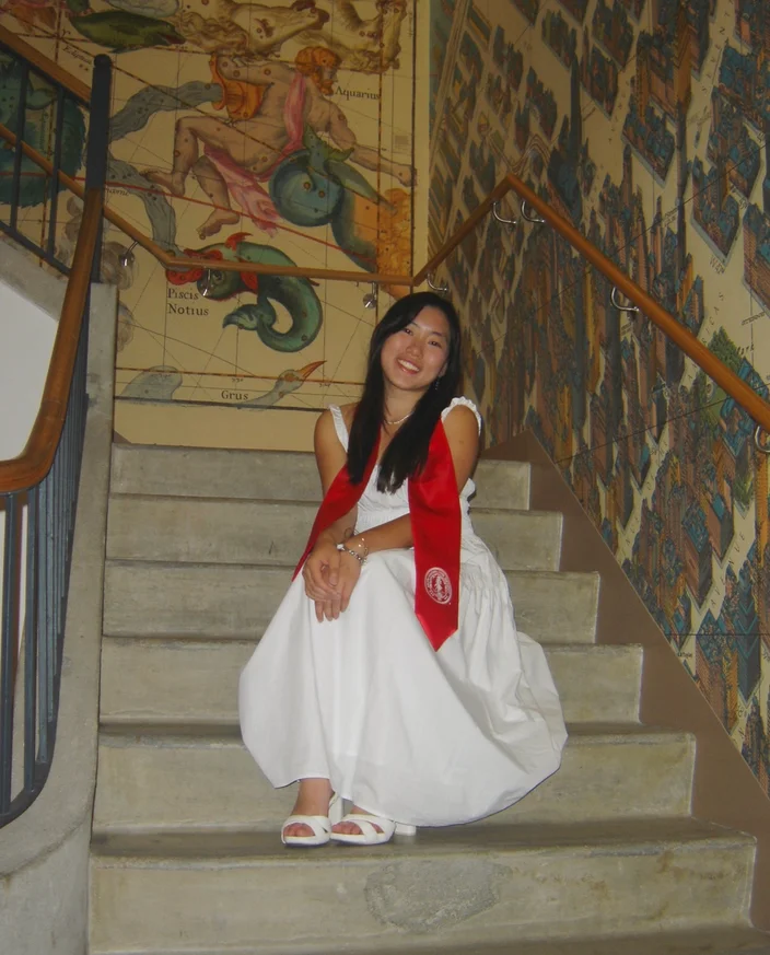 Katherine Wong seated on a staircase